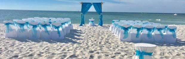 A beach wedding with white and blue decor