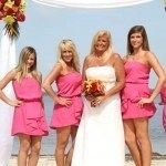 A bride and her bridesmaids posing for the camera.