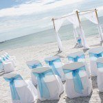 A beach wedding with white and blue decor