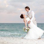 A bride and groom on the beach