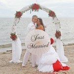 A couple is posing for their wedding picture.