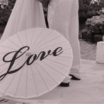 A black and white picture of a parasol with the word Love