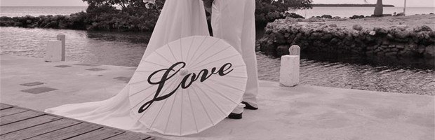 A black and white picture of a parasol with the word Love