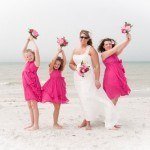 A bride and her bridesmaids on the beach