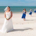 A bride and her bridesmaids on the beach