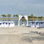 A beach wedding with white and blue decorations