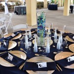 A table set with plates, silverware and place settings.
